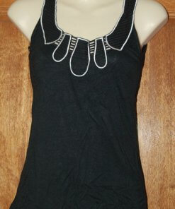 Black top with white stitching and cutouts